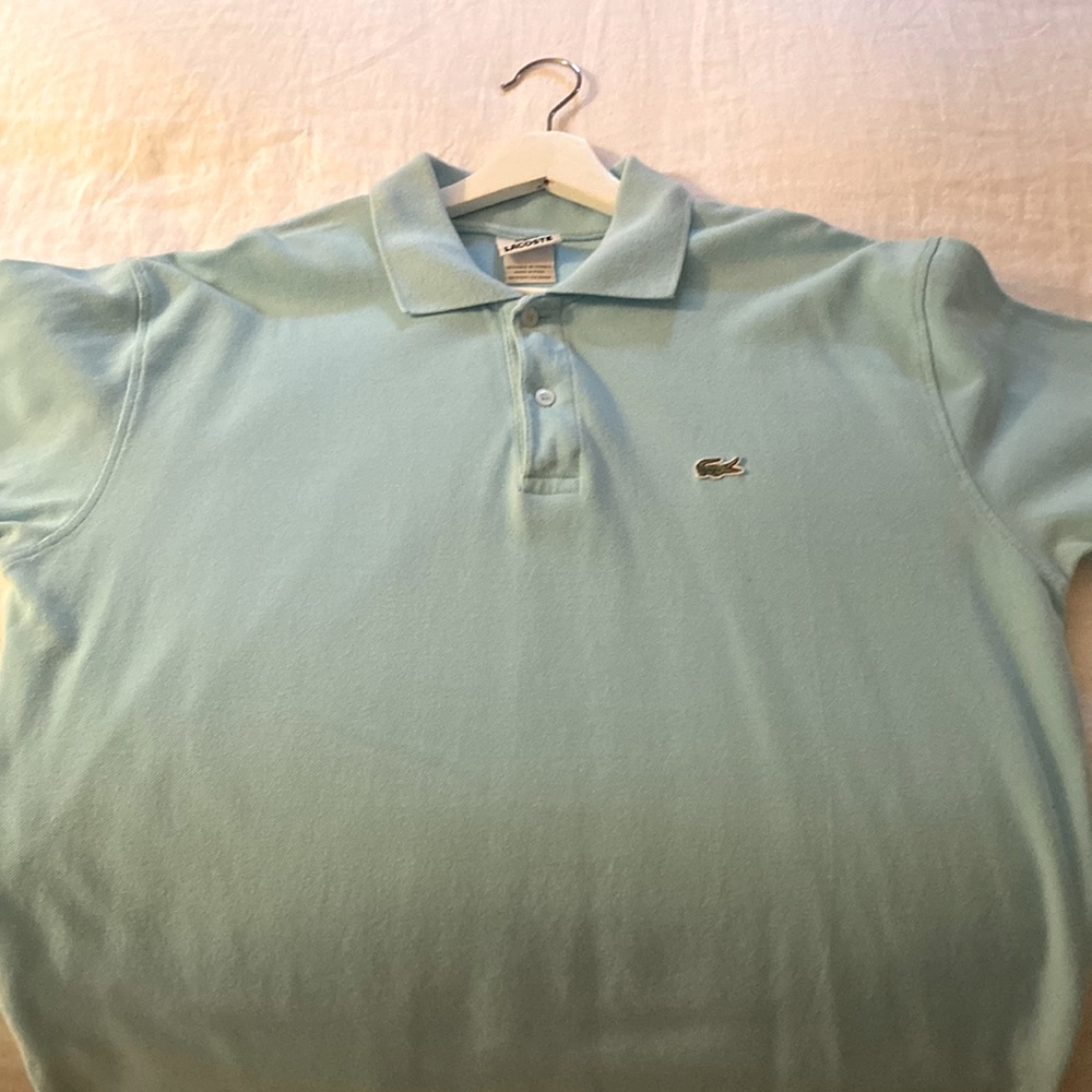 Aqua Blue cotton pique polo. Classic fit.  Tag size 8…I believe it to be an XXL